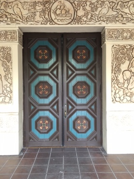Colorful wooden door off the The House of Hospitality courtyard